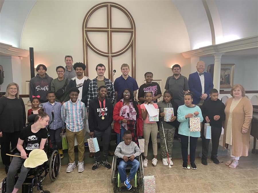 Students take a break from their spiritual journey for a group photo inside the chapel.